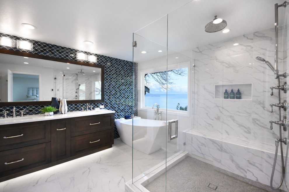Design ideas for a large transitional master bathroom in Seattle with shaker cabinets, dark wood cabinets, a freestanding tub, a corner shower, a two-piece toilet, porcelain tile, white walls, porcelain floors, an undermount sink, engineered quartz benchtops, white floor, a hinged shower door, white benchtops, a shower seat, a double vanity, a built-in vanity and white tile.