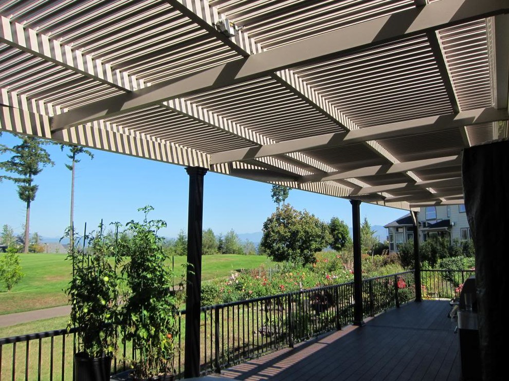 Patio - large transitional backyard patio idea in Phoenix with decking and a roof extension