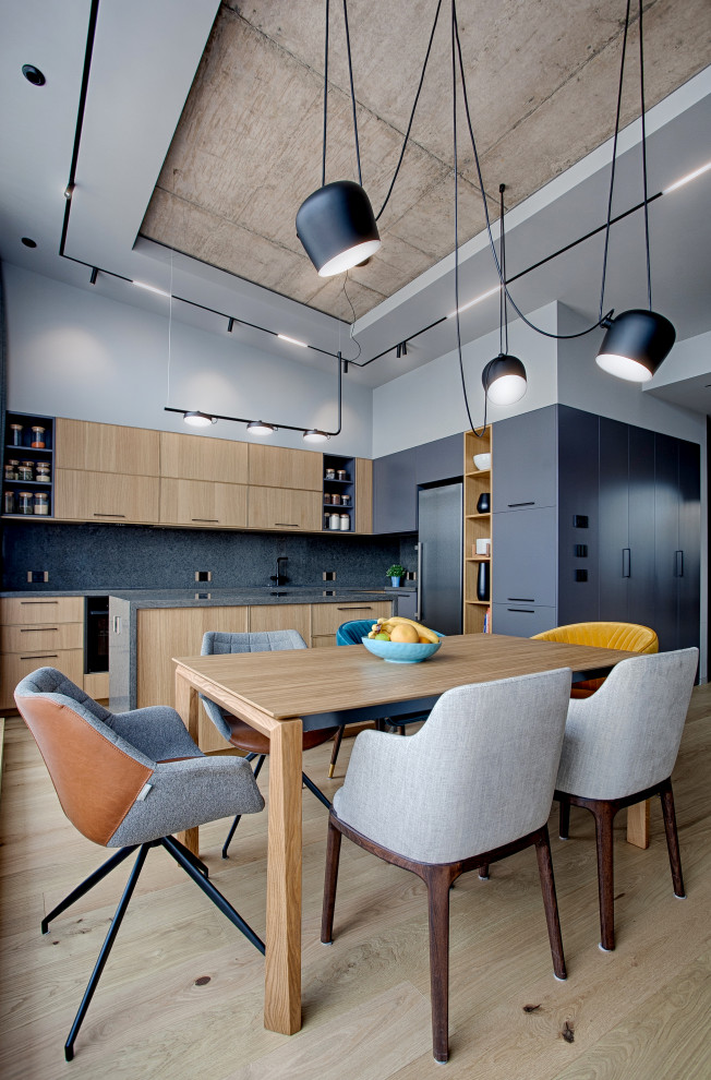 Inspiration for a mid-sized contemporary light wood floor dining room remodel in Other with gray walls