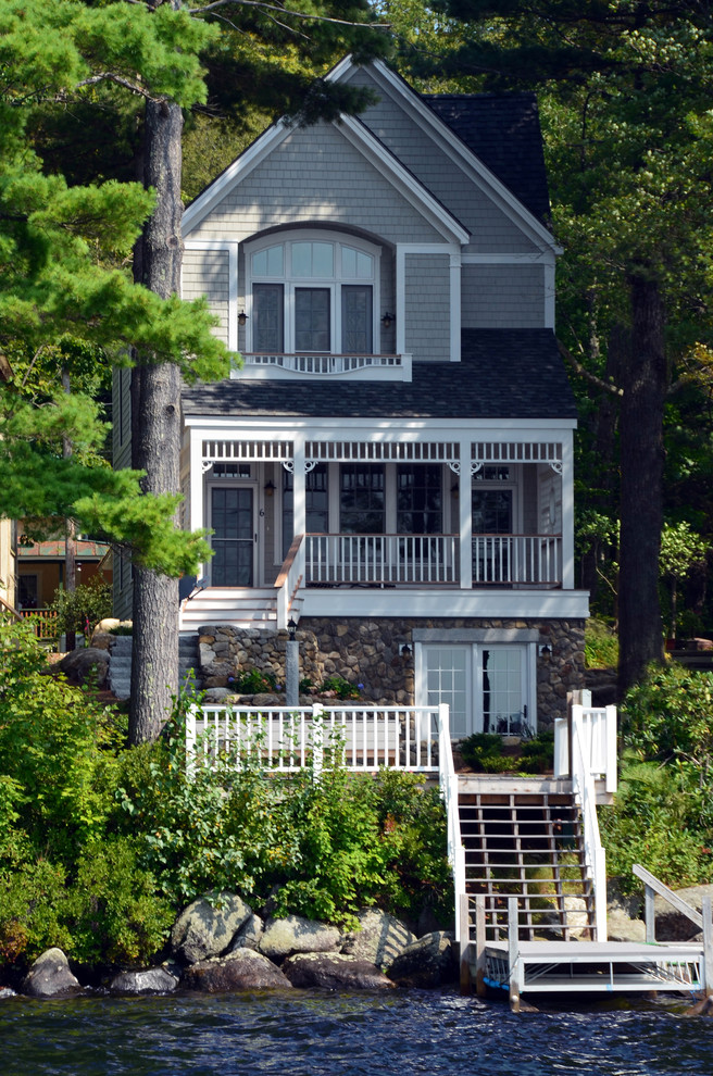 Photo of a mid-sized traditional three-storey grey exterior in Boston with wood siding.