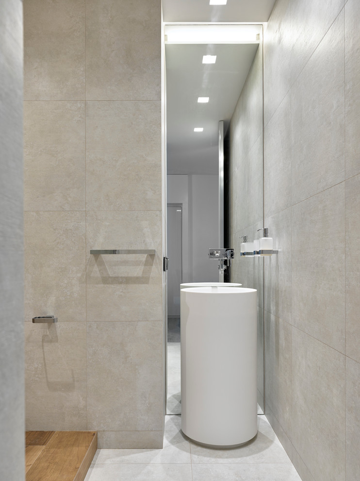 Photo of a contemporary bathroom in Moscow with beige walls and a pedestal sink.