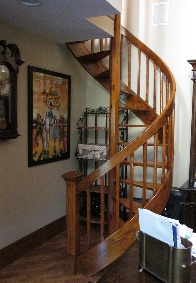 Design ideas for a small wood spiral staircase in New York with open risers.