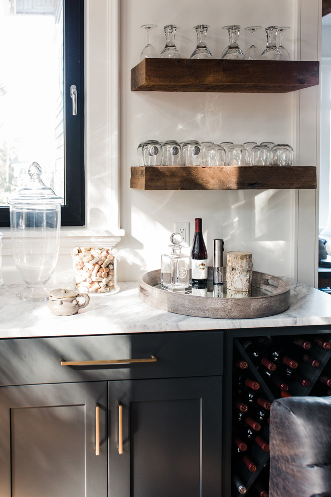 This is an example of a contemporary wet bar in Charleston with shaker cabinets, grey cabinets, brown floor and white benchtop.
