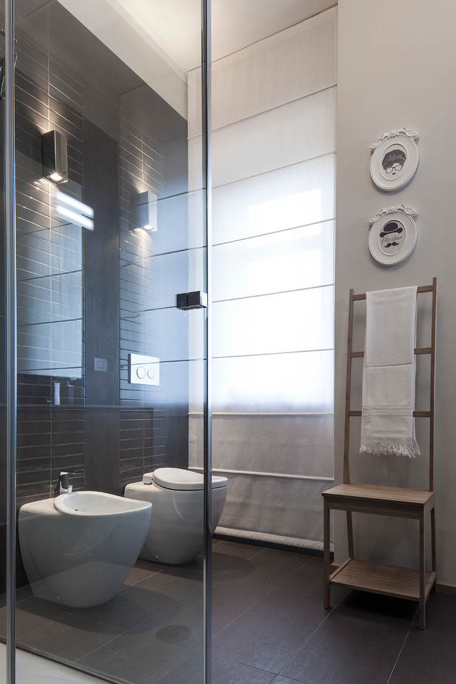 Large contemporary 3/4 bathroom in Turin with light wood cabinets, a corner shower, gray tile, porcelain tile, grey walls, porcelain floors and an integrated sink.