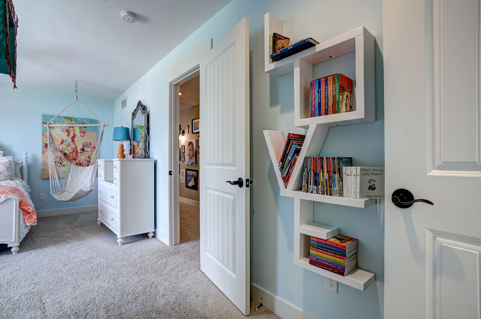 This is an example of a small country kids' bedroom for kids 4-10 years old and girls in Grand Rapids with beige walls, carpet and beige floor.