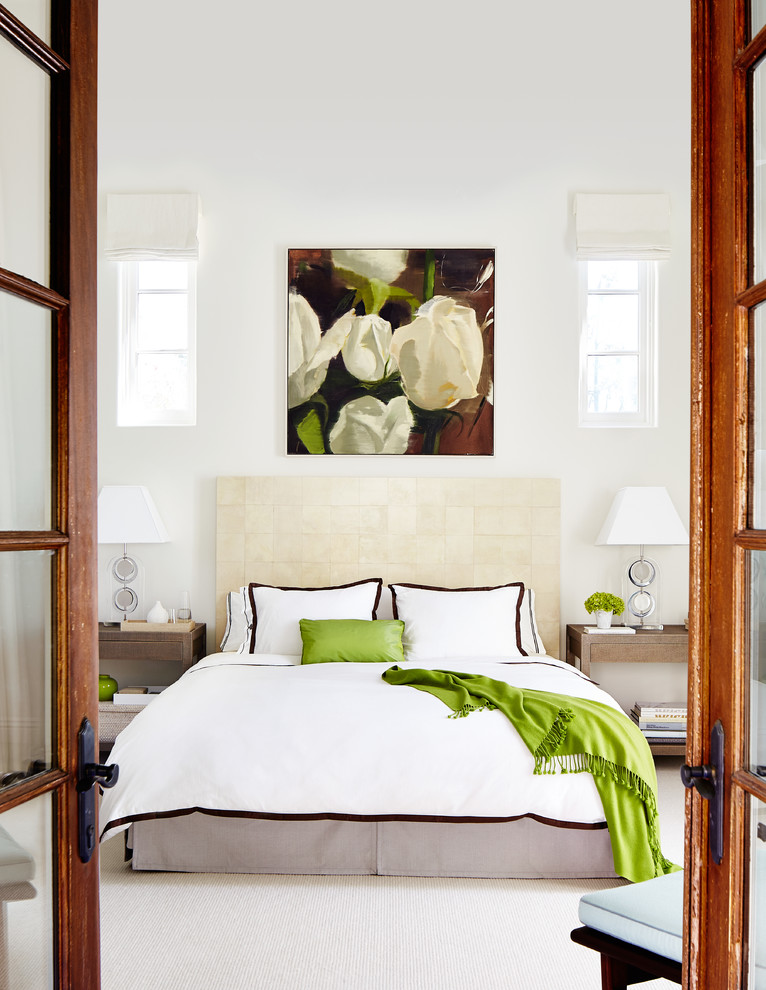 This is an example of a large transitional master bedroom in San Francisco with white walls, carpet and no fireplace.