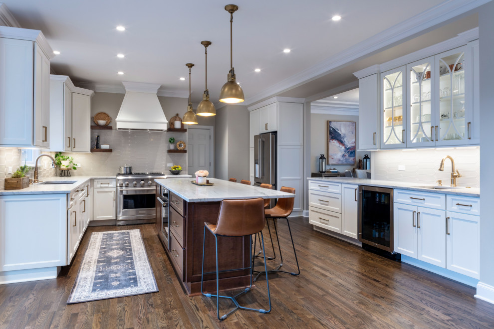Kitchen - transitional medium tone wood floor kitchen idea with shaker cabinets, quartzite countertops, stainless steel appliances and an island