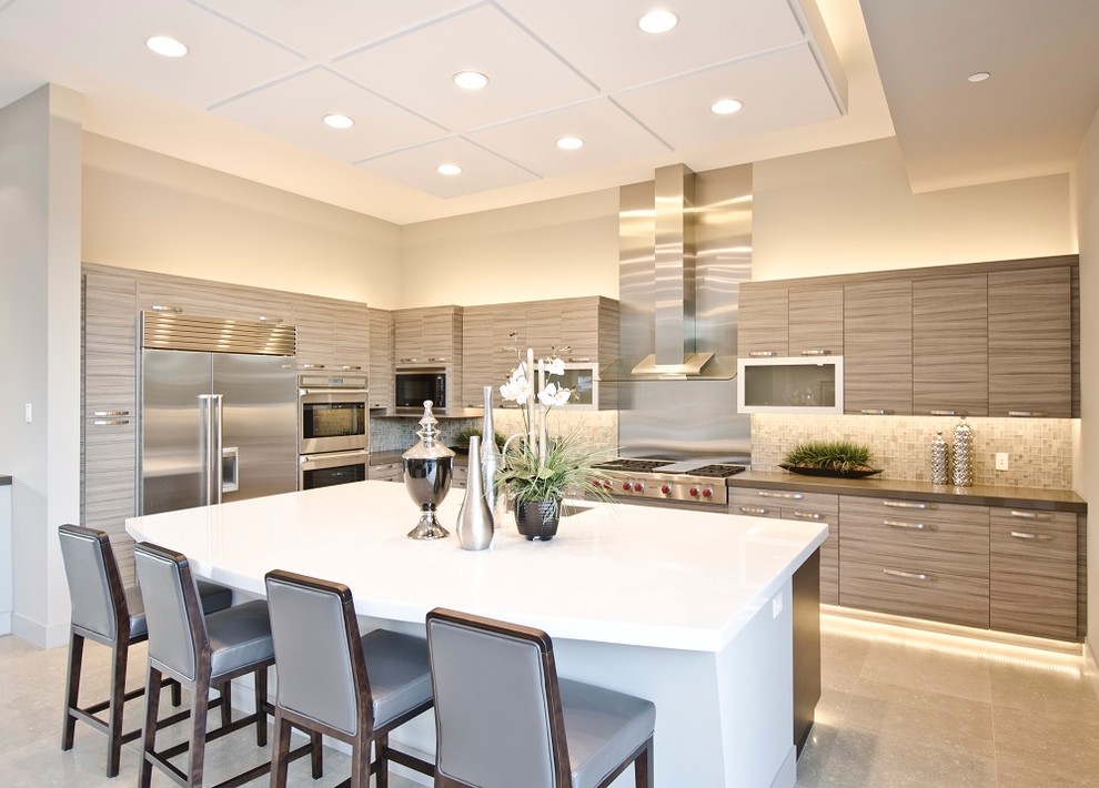 Contemporary l-shaped kitchen in Los Angeles with flat-panel cabinets, medium wood cabinets, multi-coloured splashback, mosaic tile splashback, stainless steel appliances and with island.
