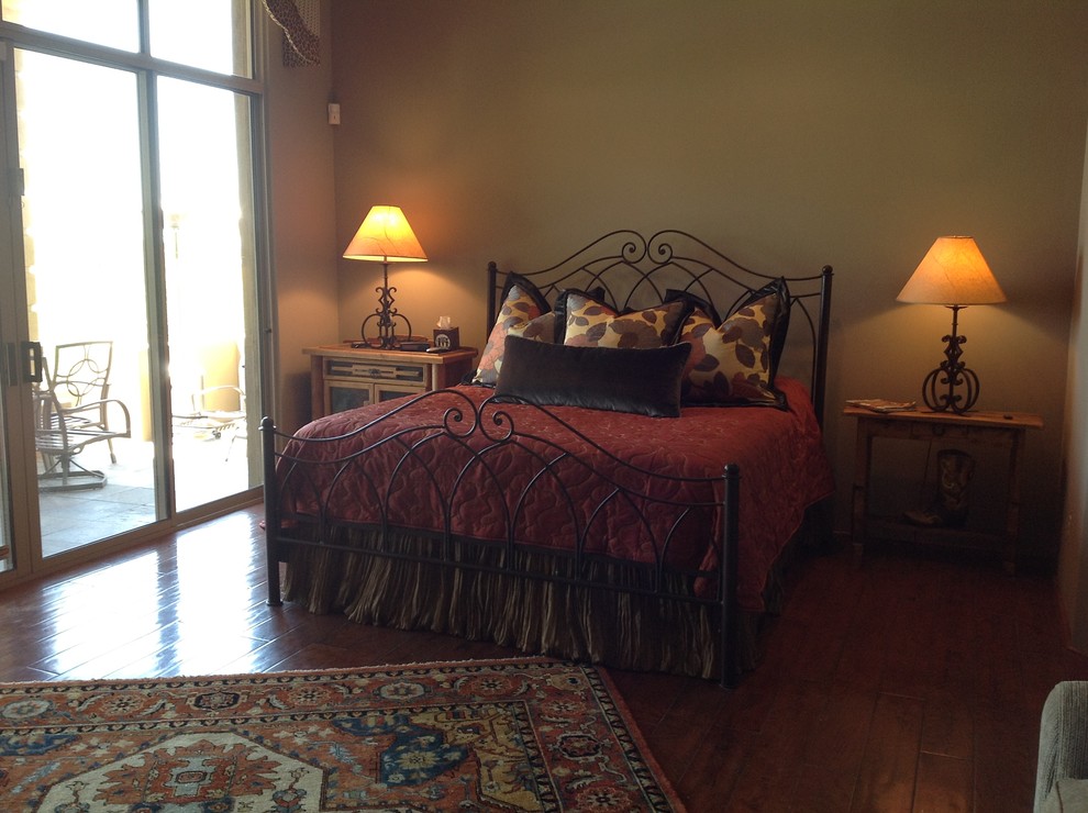 Design ideas for a mid-sized transitional master bedroom in Phoenix with beige walls, dark hardwood floors and no fireplace.
