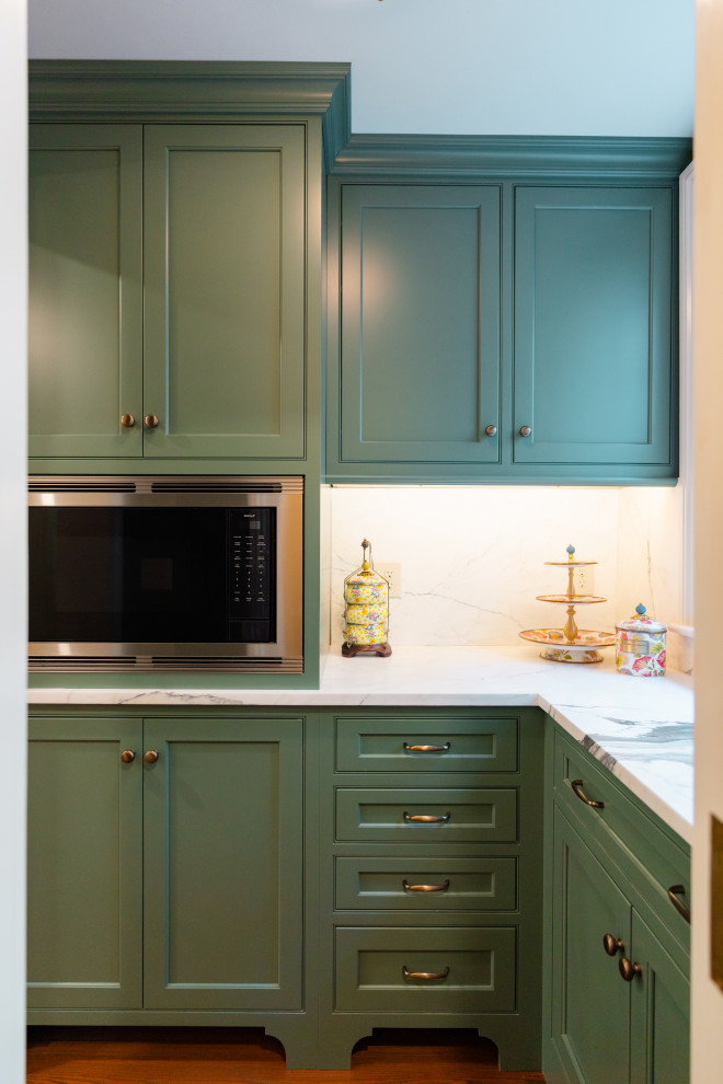 Design ideas for a mid-sized traditional l-shaped kitchen pantry in Charleston with beaded inset cabinets, marble benchtops, dark hardwood floors, brown floor, multi-coloured benchtop, multi-coloured splashback, marble splashback, stainless steel appliances and green cabinets.