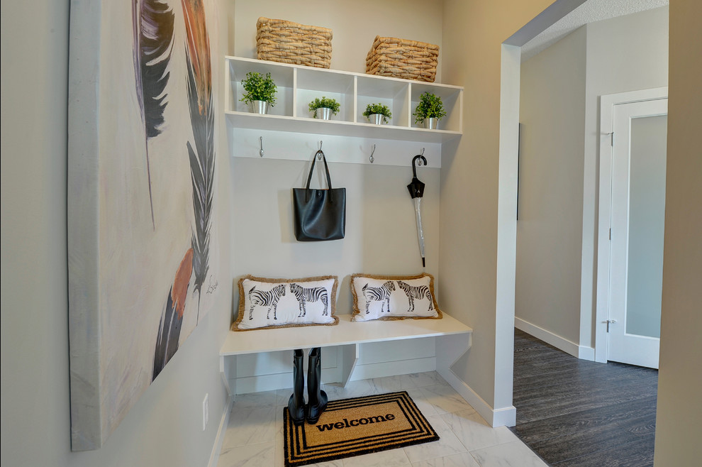 Mid-sized transitional ceramic tile and white floor mudroom photo in Edmonton with beige walls and a white front door