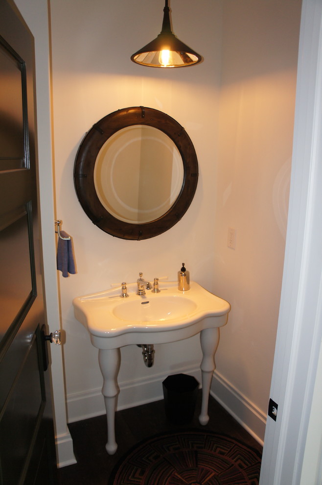 This is an example of a country powder room in Other.