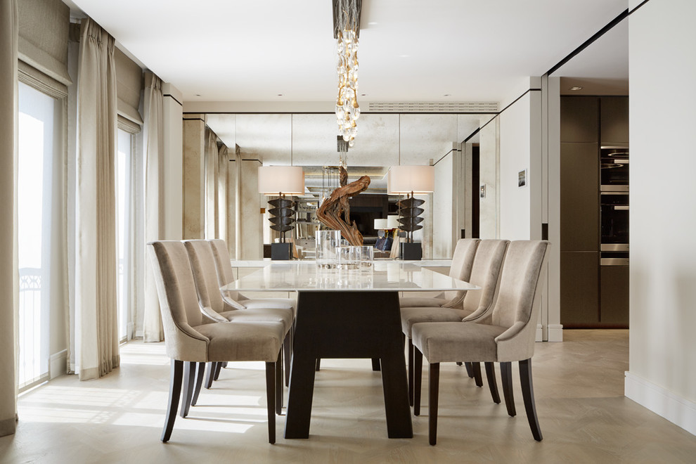 Photo of a contemporary dining room in London with beige walls.