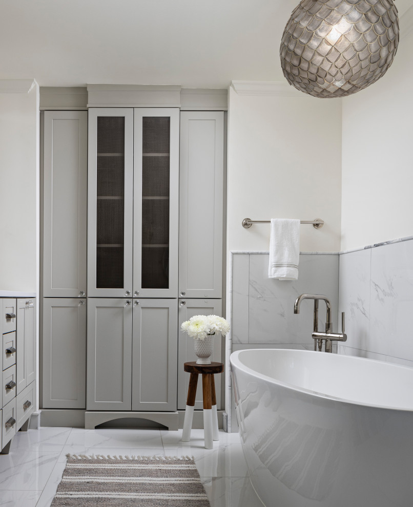 Inspiration for a large traditional ensuite bathroom in Detroit with shaker cabinets, grey cabinets, a freestanding bath, white tiles, porcelain tiles, white walls, porcelain flooring, engineered stone worktops, white floors, white worktops, double sinks and a built in vanity unit.