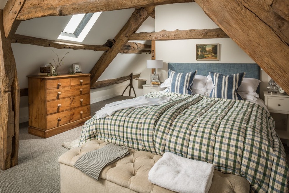 Inspiration for a small country bedroom in Other with white walls, carpet and grey floor.