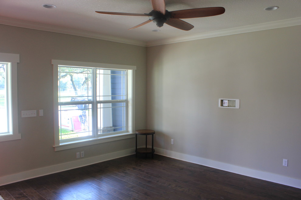 Mid-sized arts and crafts open concept family room in Tampa with beige walls and medium hardwood floors.