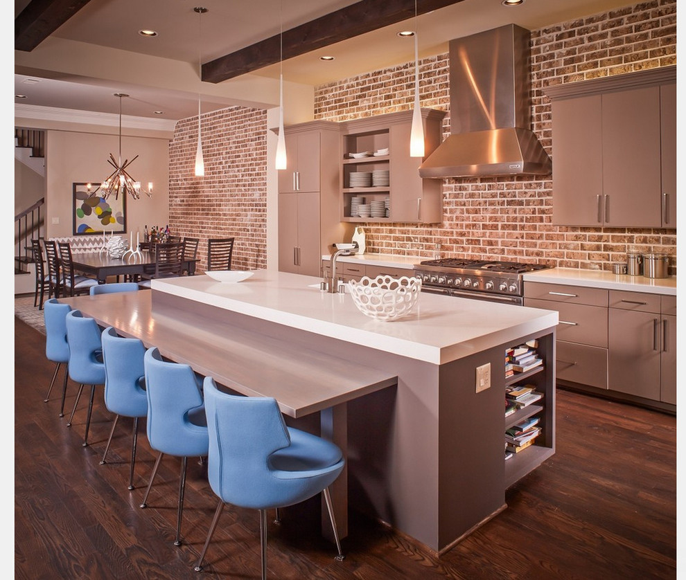 This is an example of a large modern u-shaped open plan kitchen in New York with an undermount sink, flat-panel cabinets, grey cabinets, quartz benchtops, brick splashback, stainless steel appliances, dark hardwood floors, with island and brown floor.