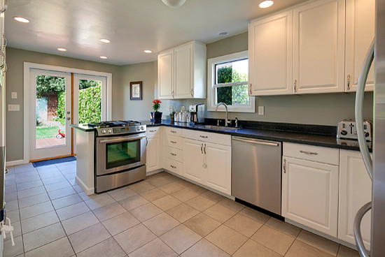 Mid-sized traditional l-shaped separate kitchen in Seattle with raised-panel cabinets, white cabinets and no island.