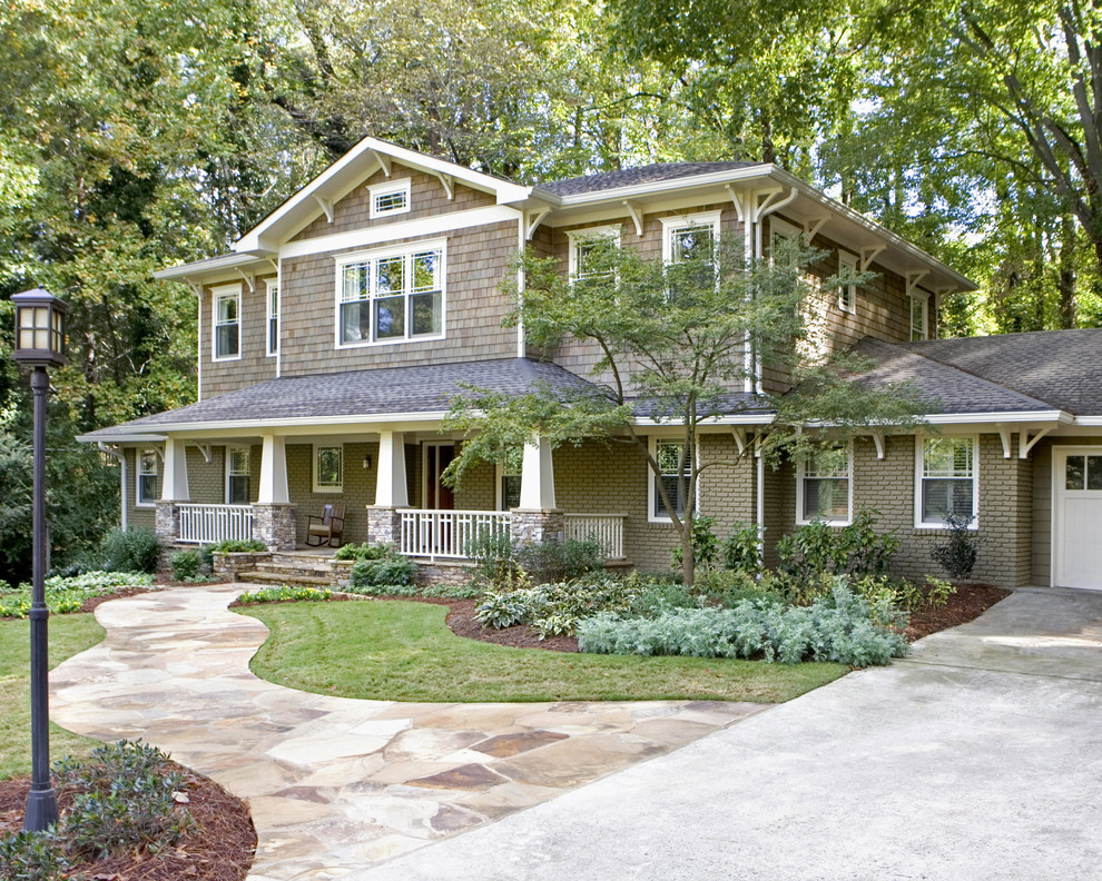 Inspiration for a traditional two-storey exterior in Atlanta with wood siding.