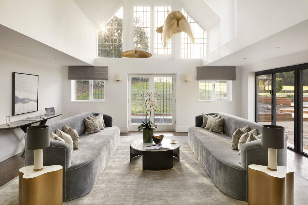 Inspiration for a huge contemporary formal and open concept brown floor living room remodel in London with white walls, a stone fireplace and a media wall