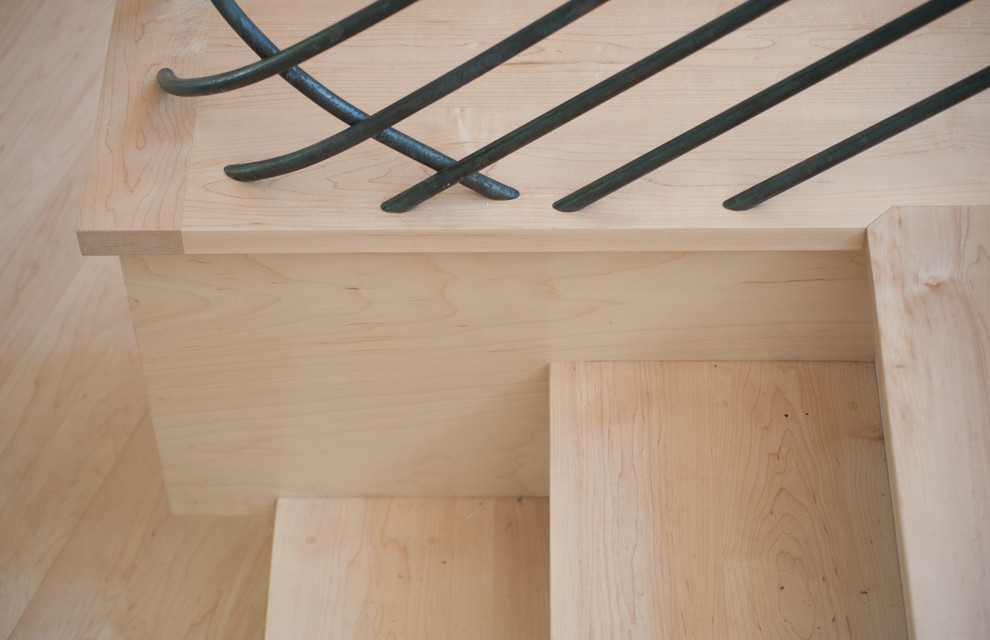 Inspiration for a large rustic wooden u-shaped staircase remodel in Burlington with painted risers