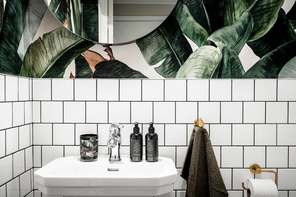 This is an example of a small scandinavian 3/4 bathroom in Gothenburg with open cabinets, white cabinets, a wall-mount toilet, white tile, ceramic tile, white walls, ceramic floors, black floor and black benchtops.