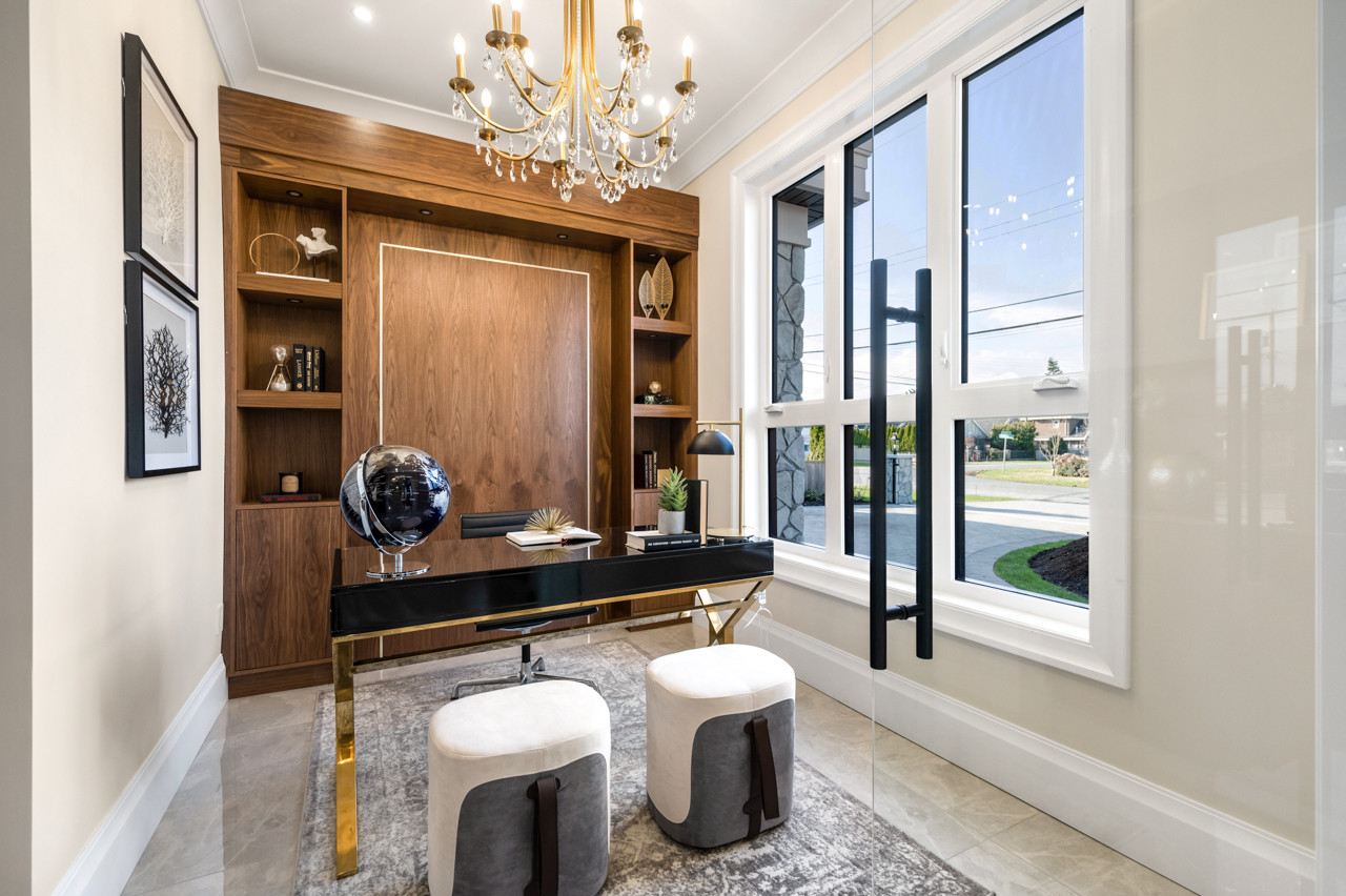 Example of a transitional home office design in Vancouver