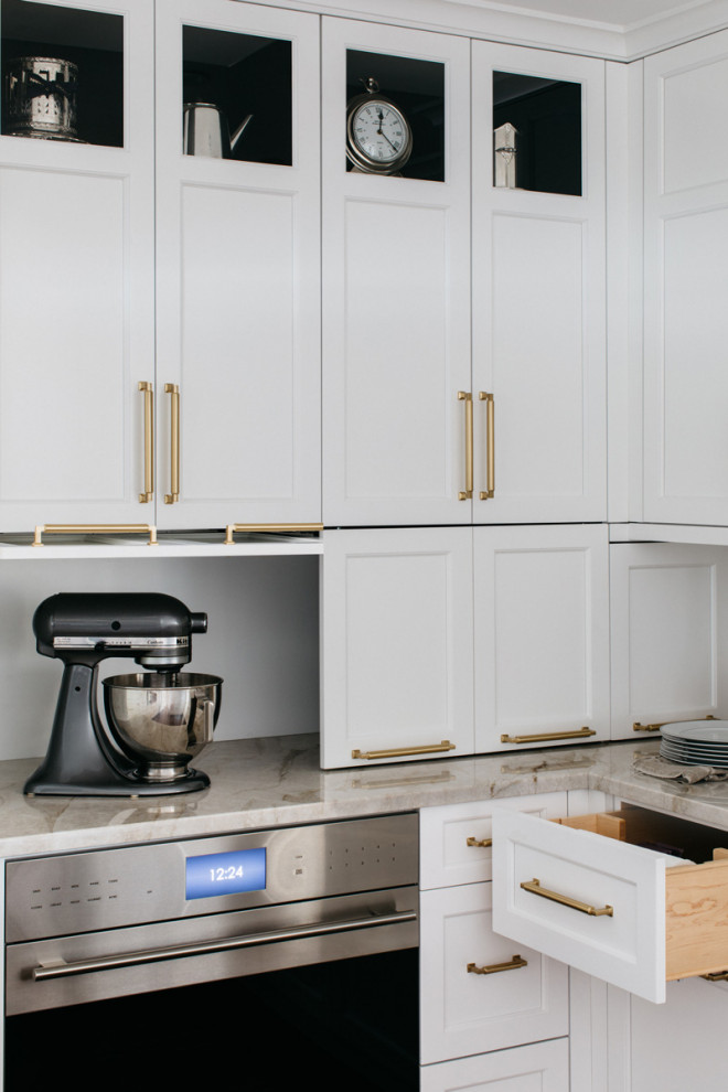 Example of a large transitional dark wood floor eat-in kitchen design in Chicago with recessed-panel cabinets, white cabinets, quartzite countertops, beige backsplash, a peninsula and beige countertops