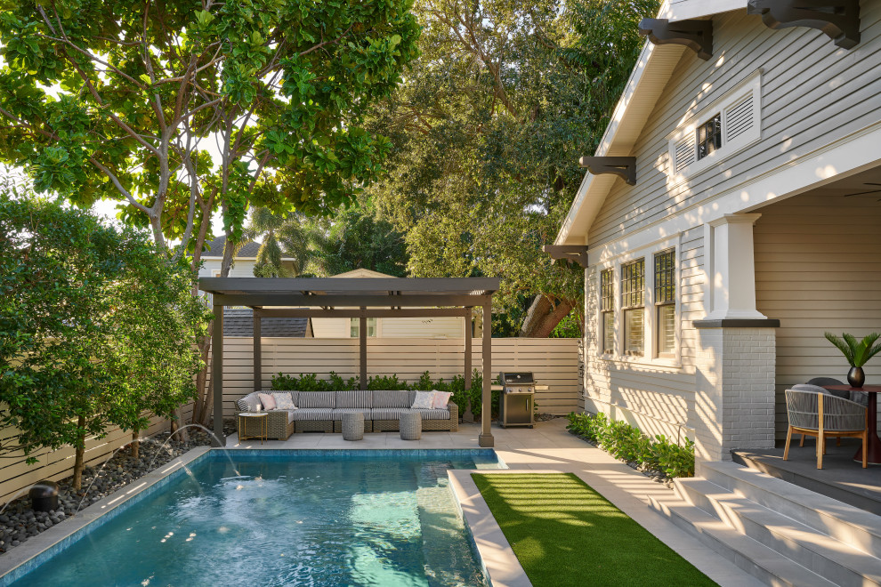 Example of a beach style pool design in Tampa