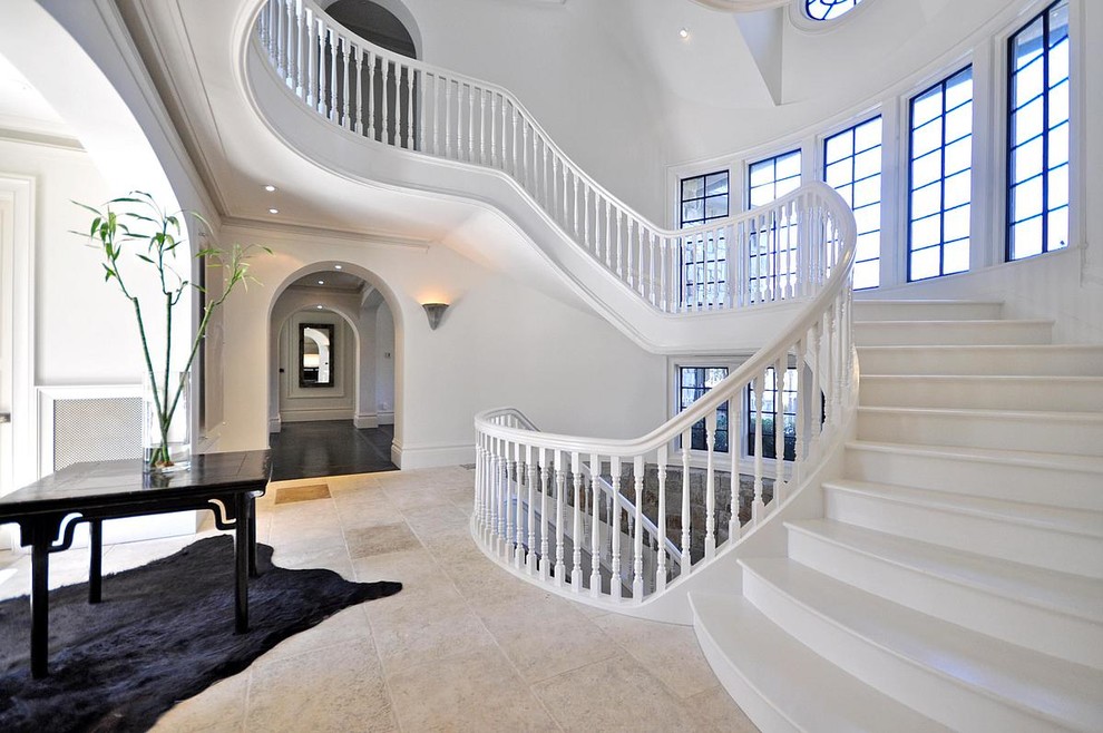 Design ideas for an expansive traditional curved staircase in New York.