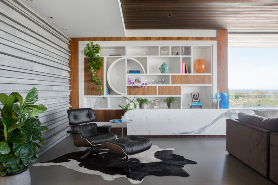 Photo of a contemporary open concept living room in Perth with grey walls, concrete floors and no fireplace.