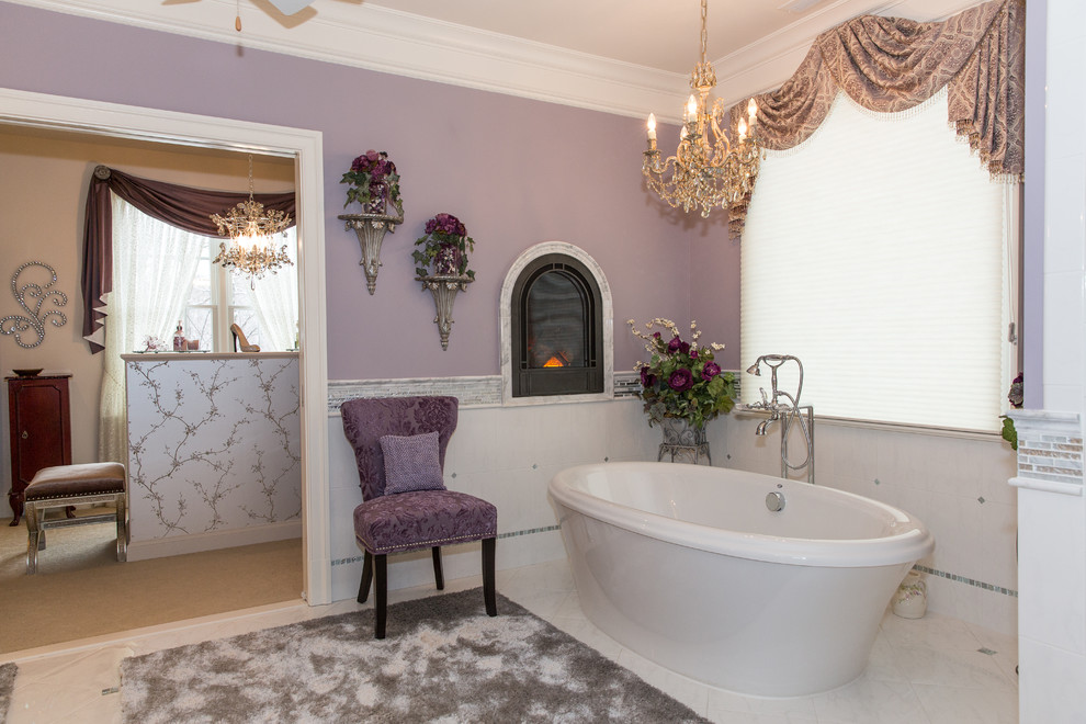 Design ideas for a traditional bathroom in DC Metro with a freestanding tub and white tile.