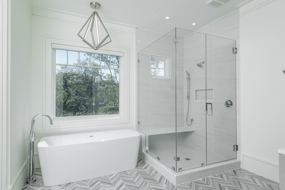 Design ideas for a large modern kids bathroom in Charleston with flat-panel cabinets, grey cabinets, a freestanding tub, a corner shower, a one-piece toilet, mirror tile, white walls, mosaic tile floors, an undermount sink, marble benchtops, grey floor, a hinged shower door and white benchtops.