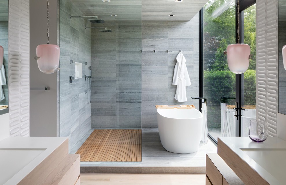 Design ideas for a country master bathroom in New York with a freestanding tub, gray tile, an open shower and a double shower.