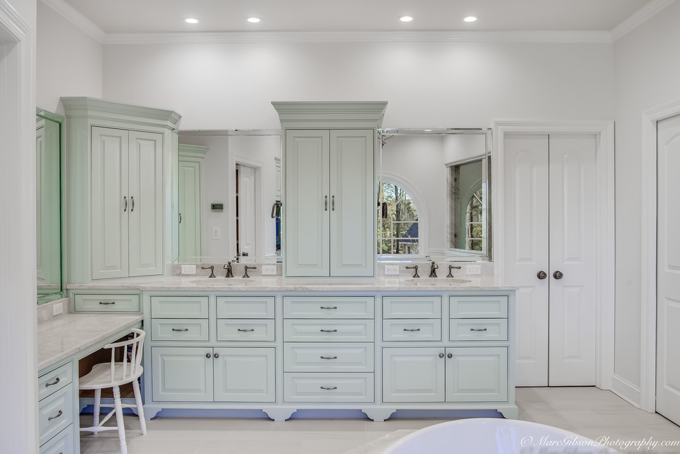 Mid-sized traditional master bathroom in Other with beaded inset cabinets, green cabinets, a freestanding tub, an open shower, a one-piece toilet, green tile, porcelain tile, white walls, ceramic floors, a drop-in sink, granite benchtops, white floor, an open shower and white benchtops.