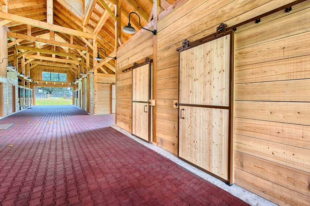 Home design - large rustic two-story wood beige home design idea
