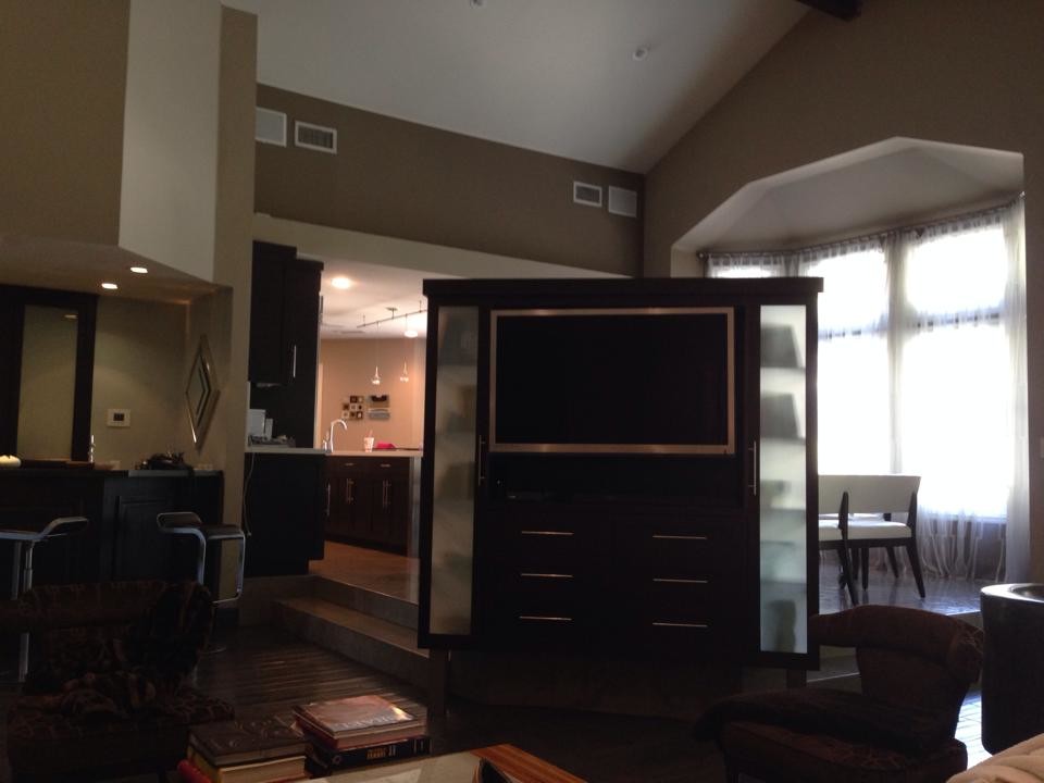 Mid-sized elegant formal and enclosed carpeted and beige floor living room photo in Los Angeles with beige walls, no fireplace and a media wall