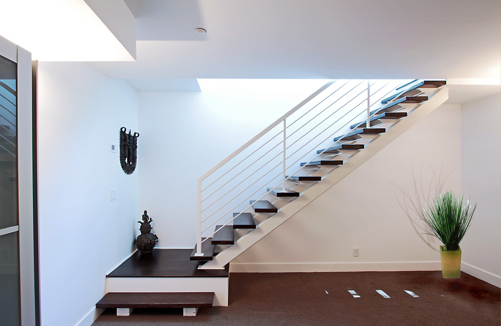 Inspiration for a large transitional wood floating staircase in DC Metro with open risers.