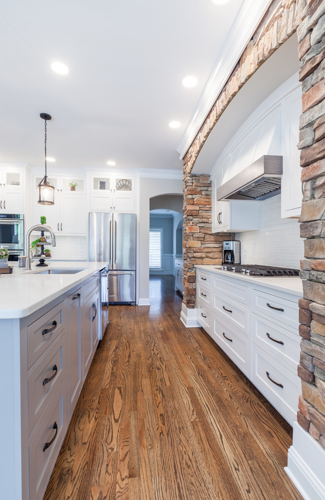 Transitional Kitchen with Natural Rock Wall