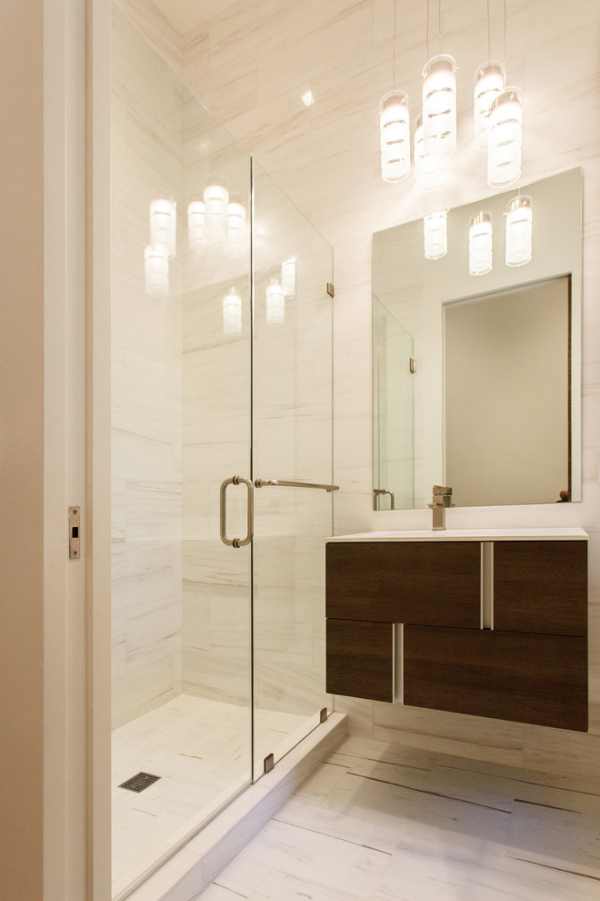Photo of a mid-sized modern 3/4 bathroom in San Francisco with flat-panel cabinets, dark wood cabinets, an alcove shower, beige tile, porcelain tile, beige walls, an undermount sink, a hinged shower door, white benchtops, porcelain floors, engineered quartz benchtops and white floor.