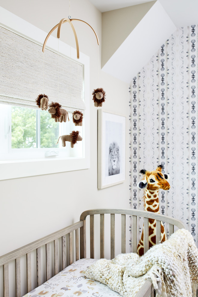 Photo of a mid-sized transitional gender-neutral nursery in DC Metro with beige walls, carpet and beige floor.