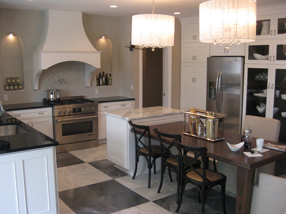 Photo of a large transitional u-shaped eat-in kitchen in Philadelphia with shaker cabinets, white cabinets, granite benchtops, grey splashback, mosaic tile splashback, stainless steel appliances, marble floors, an undermount sink and with island.