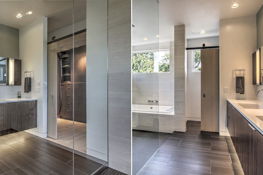 Photo of a large contemporary master bathroom in Seattle with furniture-like cabinets, dark wood cabinets, a hot tub, an open shower, a one-piece toilet, multi-coloured tile, ceramic tile, multi-coloured walls, mosaic tile floors, an undermount sink and marble benchtops.