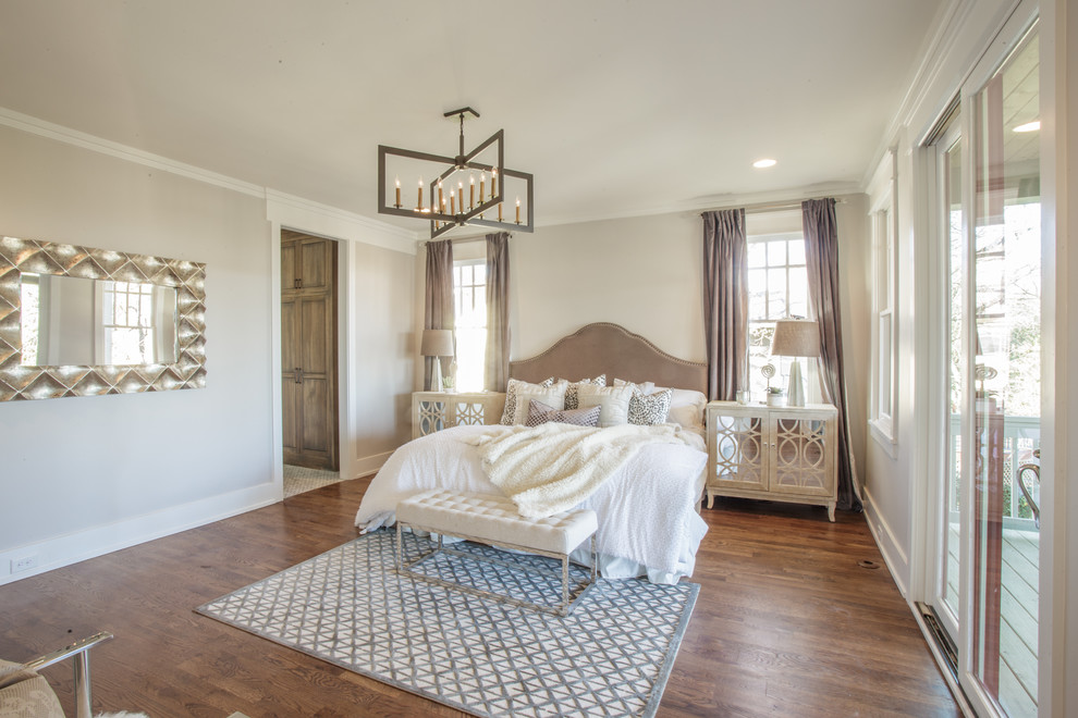Transitional bedroom in Nashville with beige walls, medium hardwood floors and brown floor.