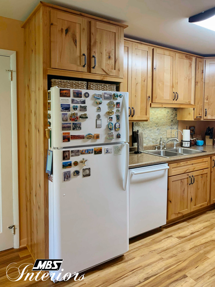 Eat-in kitchen - mid-sized rustic l-shaped light wood floor and beige floor eat-in kitchen idea with a drop-in sink, shaker cabinets, light wood cabinets, laminate countertops, multicolored backsplash, stone tile backsplash, white appliances, no island and brown countertops