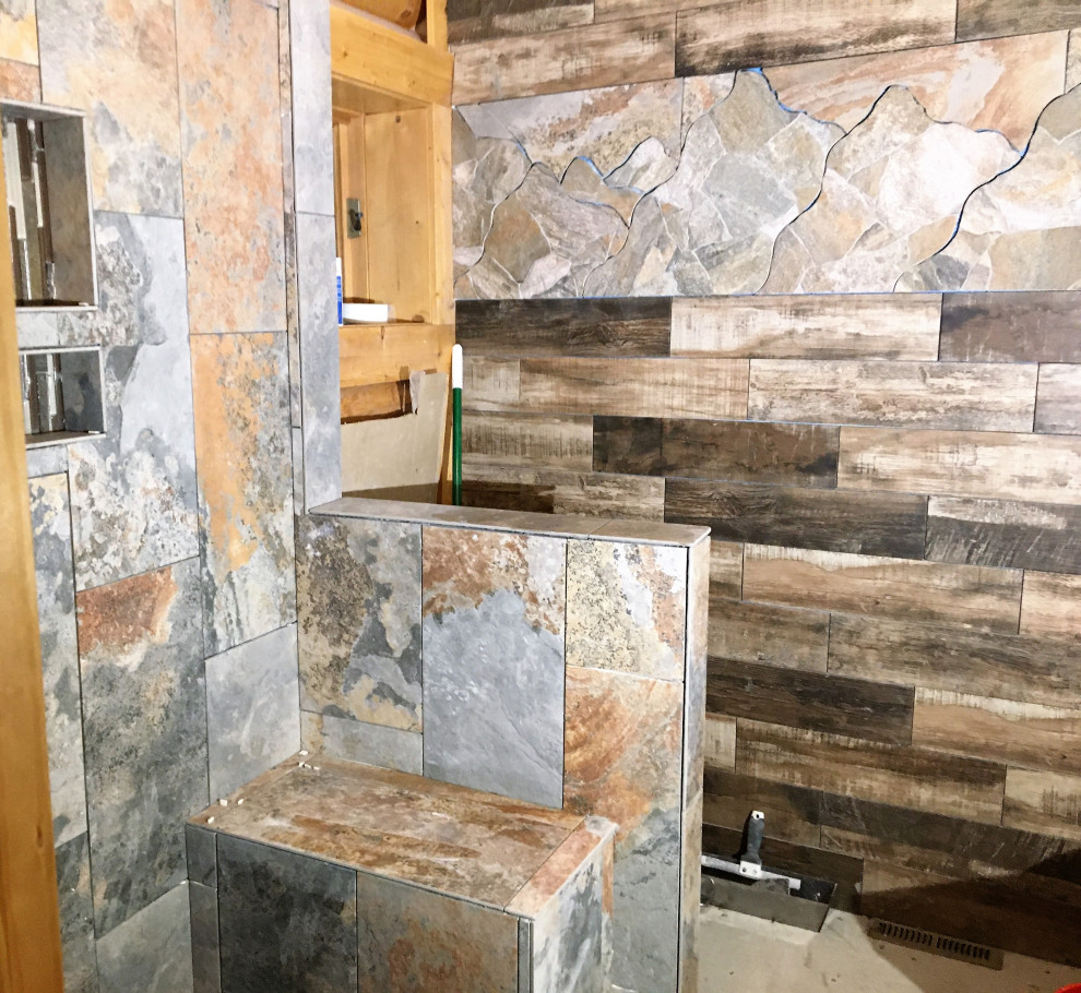 This is an example of a mid-sized country master bathroom in Denver with furniture-like cabinets, medium wood cabinets, an alcove shower, a bidet, multi-coloured tile, porcelain tile, brown walls, wood-look tile, a vessel sink, brown floor, a hinged shower door, a shower seat, a double vanity and a freestanding vanity.