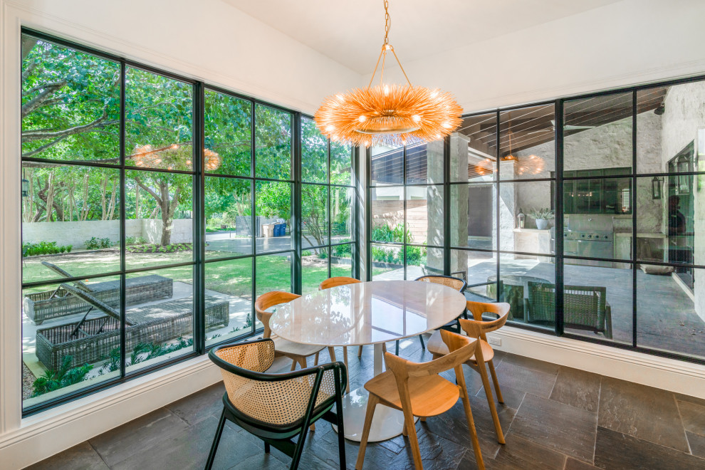 Example of a mountain style dining room design in Austin