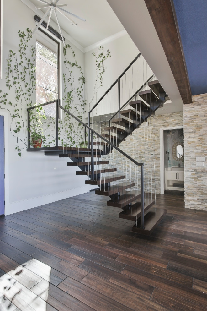 Inspiration for a medium sized contemporary wood floating wood railing staircase in Houston with wood risers.