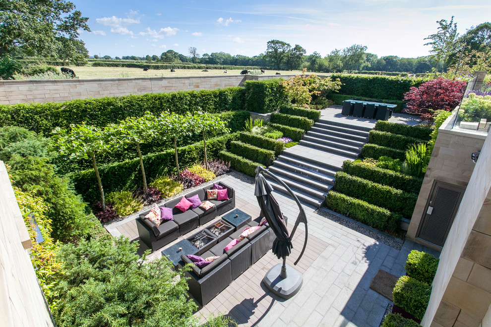 This is an example of a contemporary garden in Cheshire.