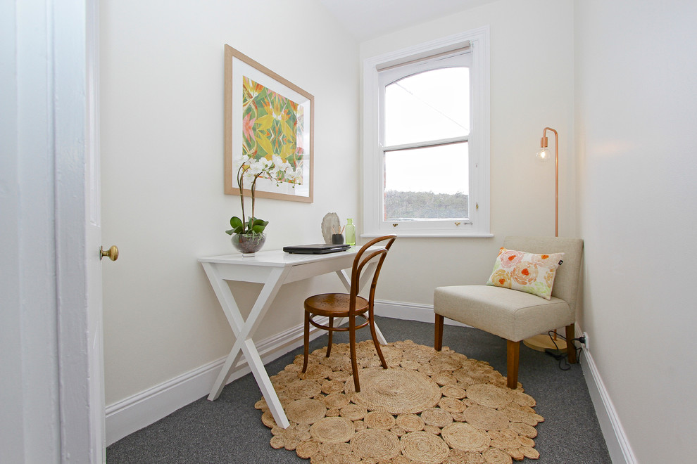 Design ideas for a transitional home office in Hobart with beige walls and carpet.